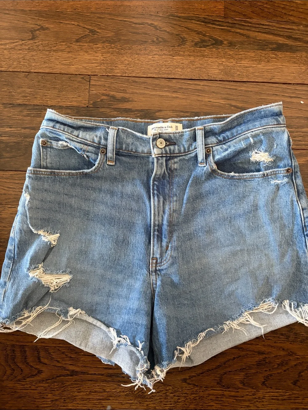 Distressed Light Blue Denim Shorts - Women's